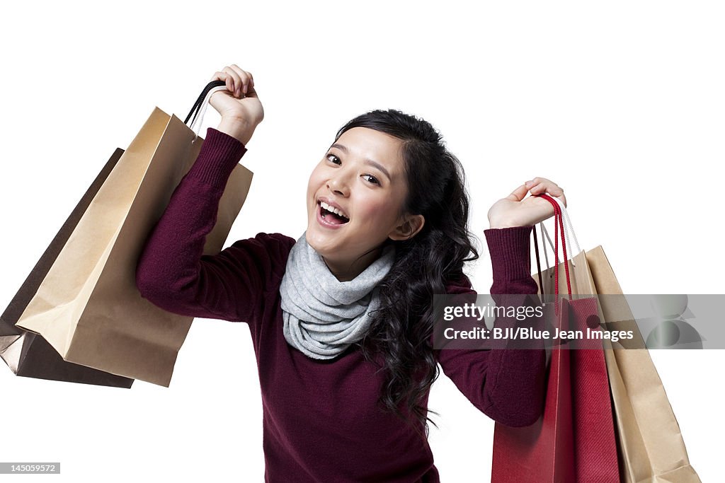 Stylish young woman going shopping