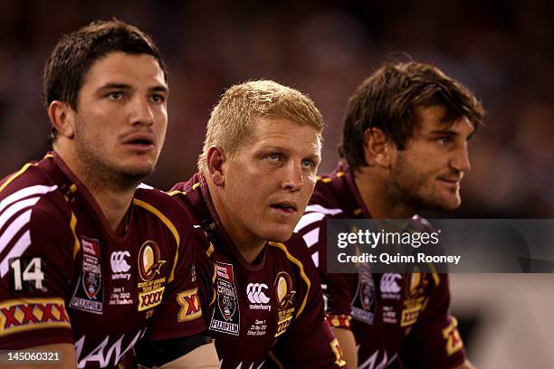 Matt Gillett, Ben Hannant and David Taylor of the Maroons look on during game one of the ARL State of Origin series between the Queensland Maroons...