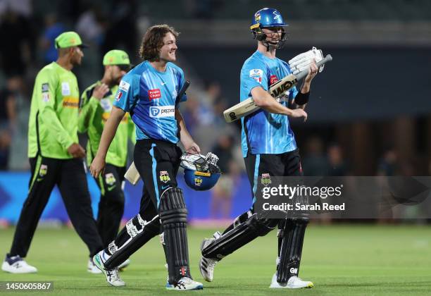 Thomas Kelly of the Strikers and Adam Hose of the Strikers after the win during the Men's Big Bash League match between the Adelaide Strikers and the...