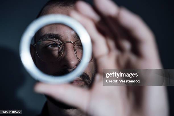 businessman examining machine part - see through stock pictures, royalty-free photos & images