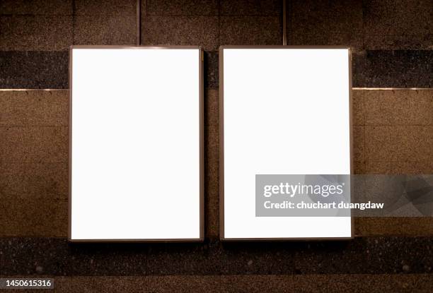 billboard blank advertising banner media display on a subway station - poster stock-fotos und bilder