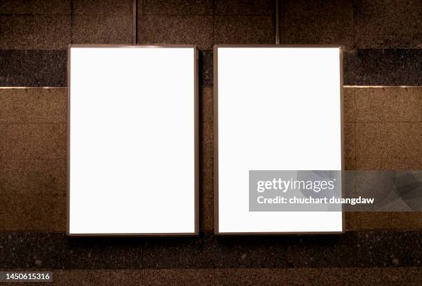 billboard blank advertising banner media display on a subway station - poster wall stock-fotos und bilder