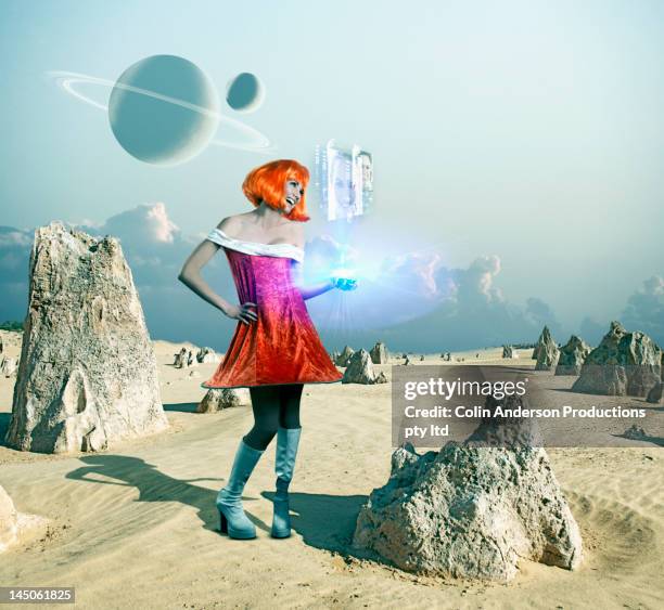 futuristic pacific islander woman standing on barren planet - pacific islander ethnicity stock-fotos und bilder