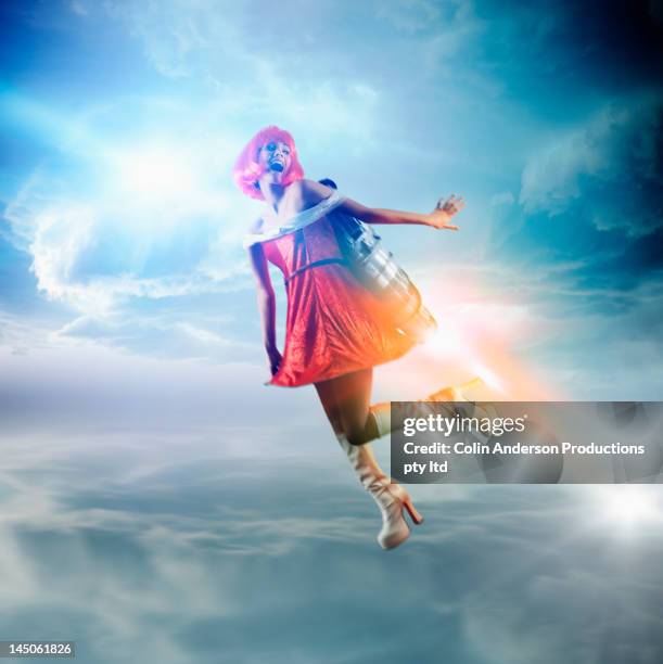 futuristic pacific islander woman flying with jetpack - rocket pack stock pictures, royalty-free photos & images