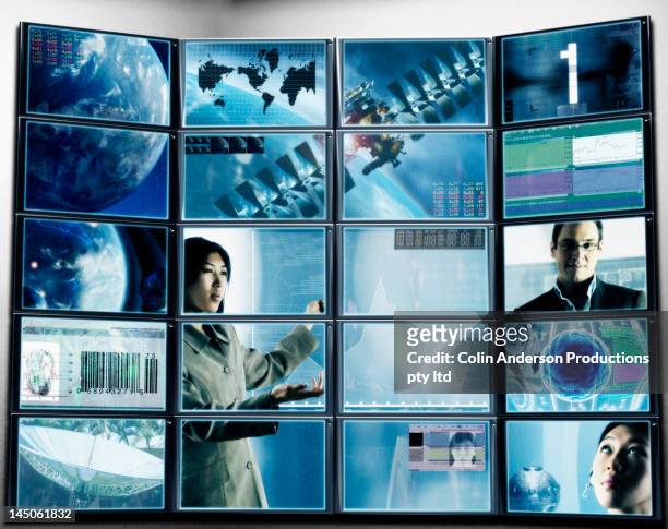 multiple digital television screens showing futuristic images - gesture control screen imagens e fotografias de stock