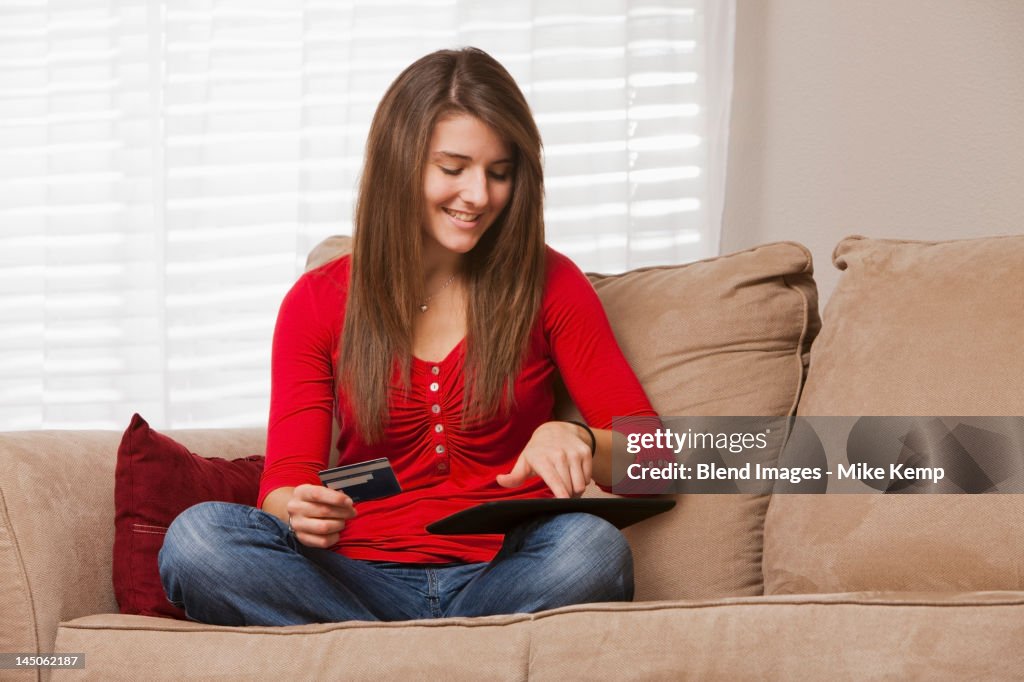 Caucasian woman shopping online using digital tablet