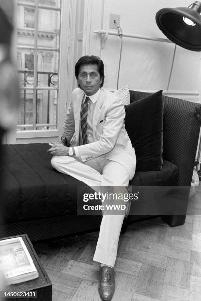 Portrait of designer Valentino Garavani during preparations for Valentino Fall 1982 Couture presentation for party in Metropolitan Museum of Art.