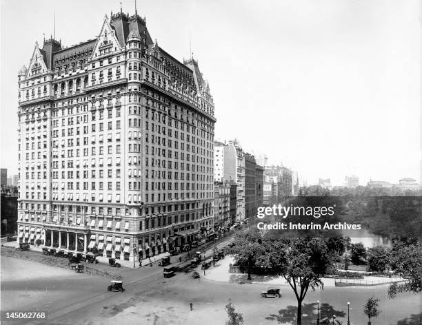 View, looking west on 59th street, of the east and north facades of the Plaza Hotel, early twentieth century. The southern end of Central Park, with...