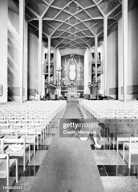 Craftsmen put the finishing touches to the new Coventry Cathedral which stands alongside the old Cathedral which was destroyed in the war. March 1962.