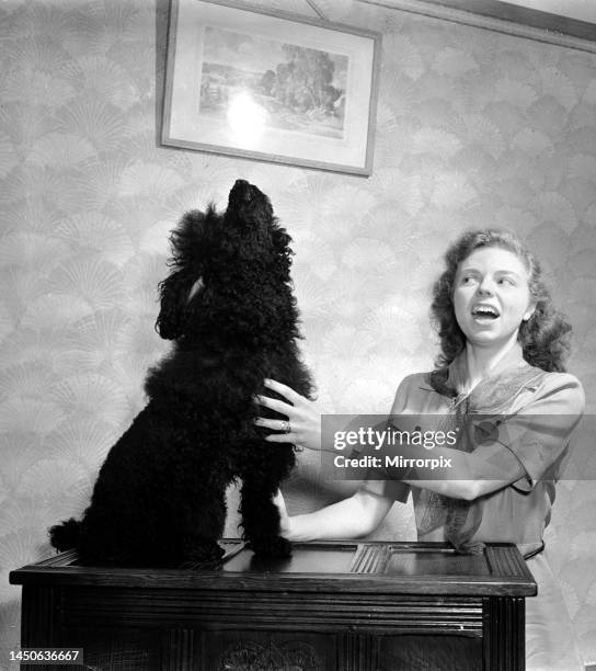Janet Davis and her singing dog. November 1951.