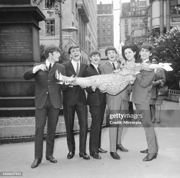 John Lennon, Paul McCartney, George Harrison, and Ringo Starr with Billy J Kramer and Susan Maughan celebrate their success at Victoria Embankment...