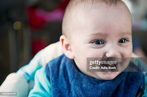 close up of babys smiling face - baby spit up stock-fotos und bilder