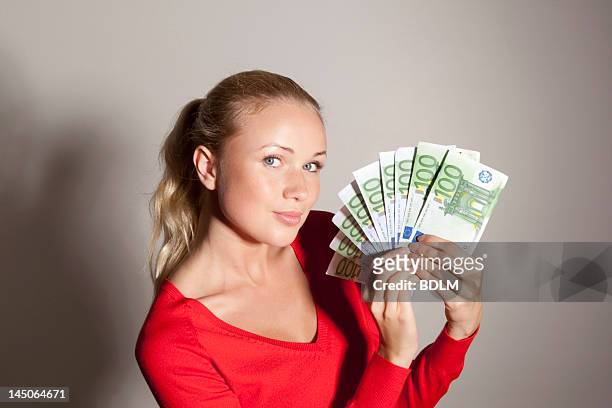 woman holding stack of euros - twenty euro note bildbanksfoton och bilder