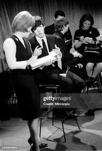 Paul McCartney talking to a reporter in New York. February 1964.