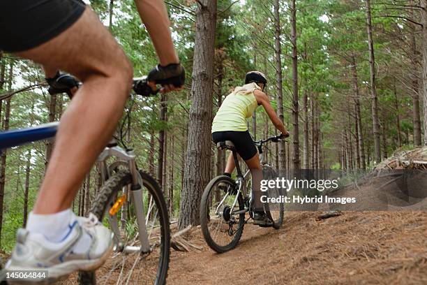 couple mountain biking in forest - the girlfriend stock pictures, royalty-free photos & images