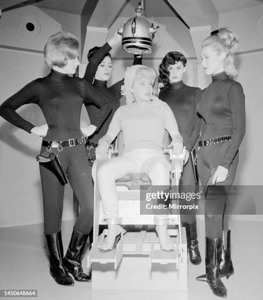 Barbara Windsor sits manacled to chair as she is interrogated and tortured for secret information by FROM agents Chris Rodgers, Jean Hamilton, Sally...