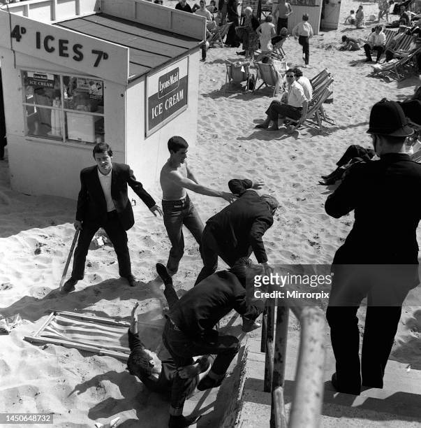 Mods and Rockers clash at Margate sea front. They were fighting on the beach the town centre and in the theme park 'Dreamland'. 20th May 1964.