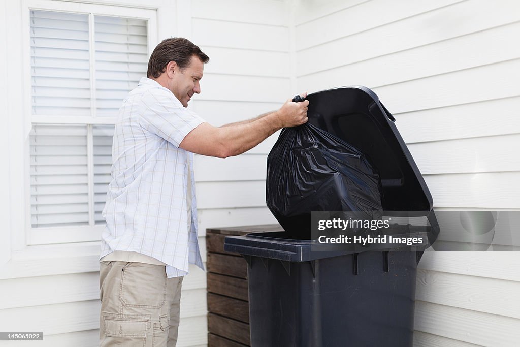 Man taking out garbage