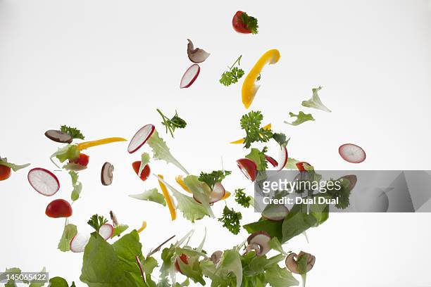 salad against a white background - throwing tomatoes stock pictures, royalty-free photos & images