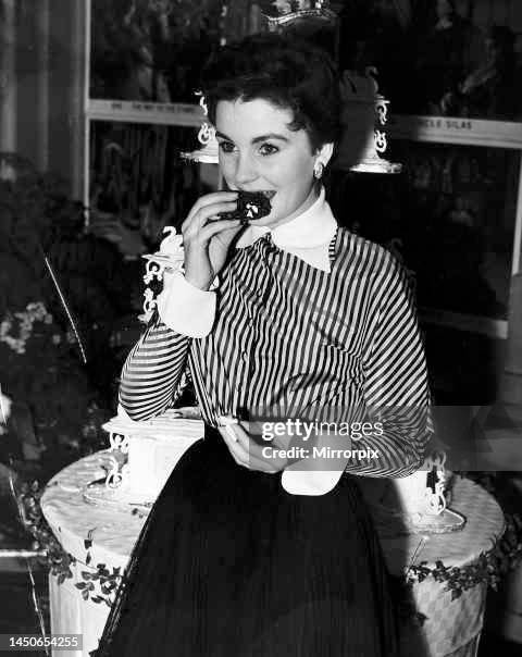 Jean Simmons actress on her 21st birthday eating cake, January 1950.