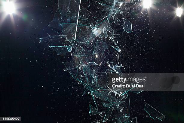 shattered glass mid-air - distruzione foto e immagini stock