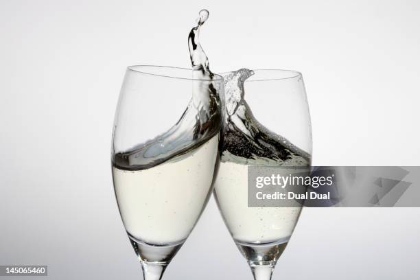 toasting with two glasses of champagne - prosecco stock pictures, royalty-free photos & images