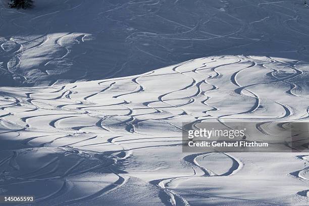 abstract pattern of ski lines on slope - ski hill stock pictures, royalty-free photos & images