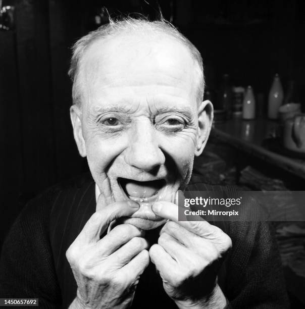 Year old man shows off his new tooth. July 1958.