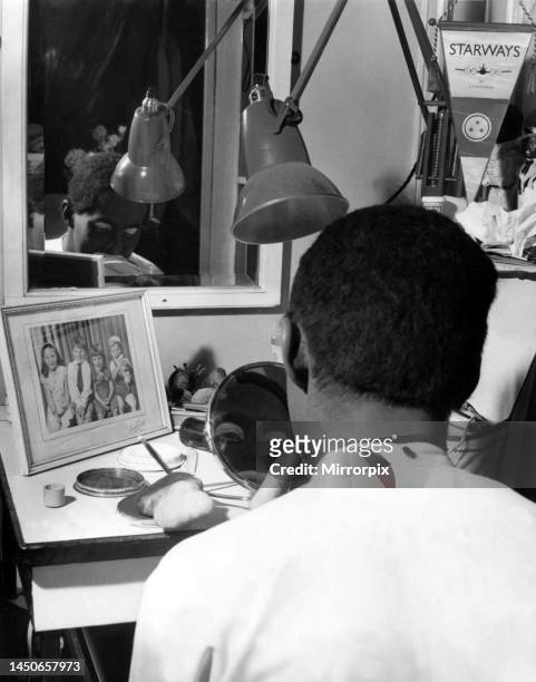 The Black and White Minstrel Show filmed at the Victoria Palace in London. John Boulter applies his make-up before the show. 8th November 1963.