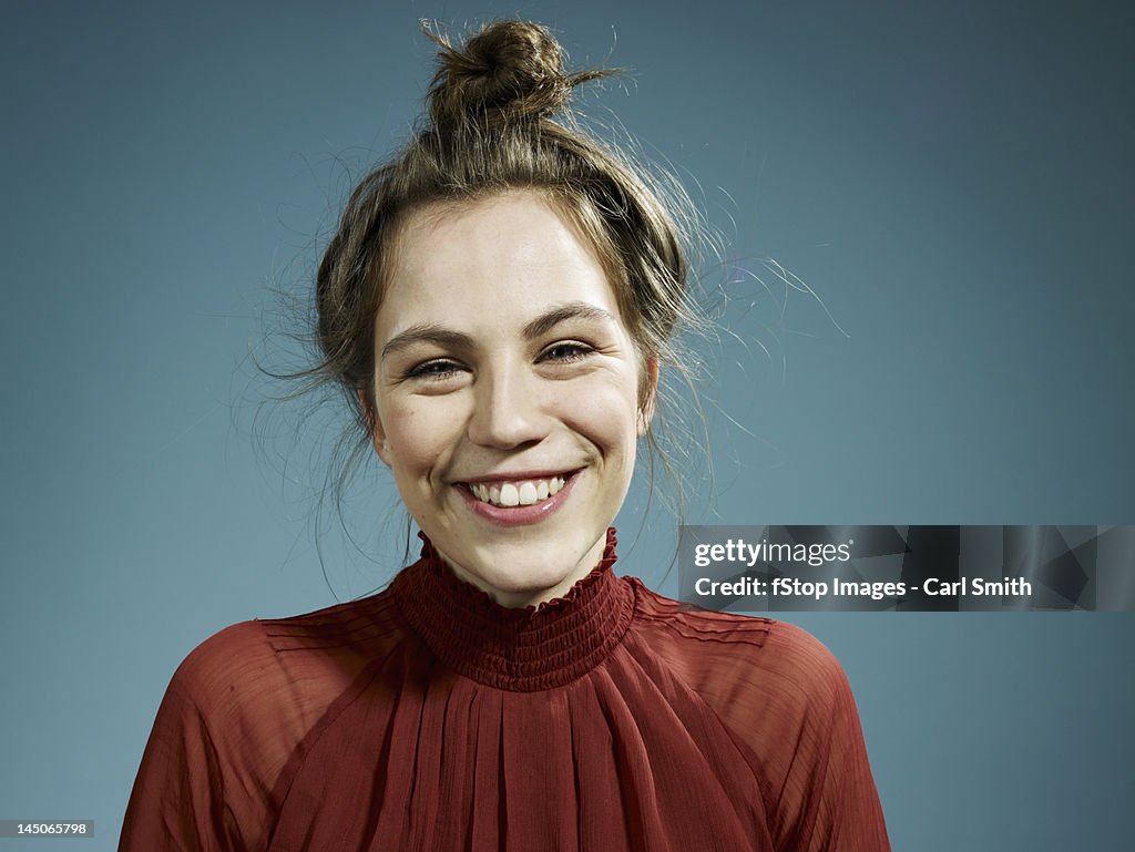 A happy hip young woman smiling at the camera