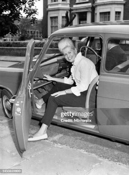 Tina Butler, a female driving instructor seen here giving a driving lesson. 6th September 1962.