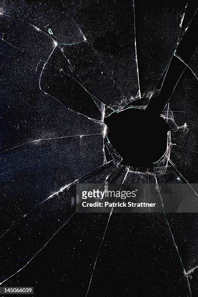 a window with a hole broken through the glass, night - hole stock pictures, royalty-free photos & images
