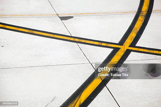 road markings on an airplane runway - crisscross stock pictures, royalty-free photos & images