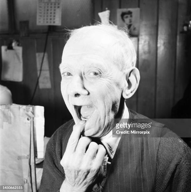 Year old man shows off his new tooth. July 1958.