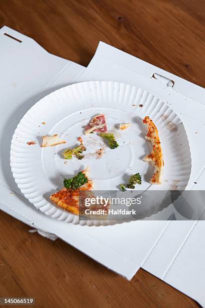 pizza crusts on a paper plate in a cardboard box - paper plate stock pictures, royalty-free photos & images