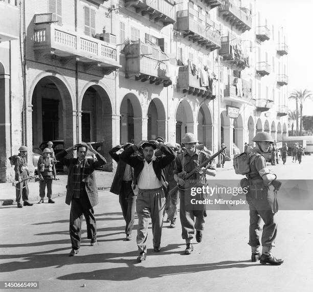 Suez Crisis 1956 - Troops assisted by CID officers from Cyprus search Arab Town district of Port Said for the kidnappers of Lieutenant Moorhouse....