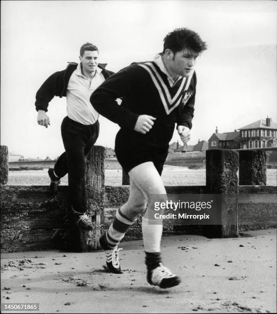 Determined Flash Flanagan sets out on a run followed by Bunting. 15th May 1964.