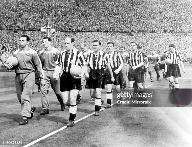 Jimmy Scoular leads Newcastle United out onto the pitch at Wembley Stadium for the FA Cup Final against Manchester City, 7th May 1955. Behind Scoular...