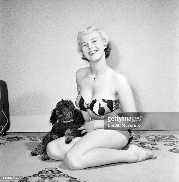 Pat Bolton seen here with her pet poodle dog. 1964.