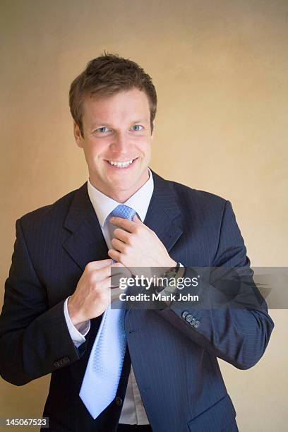 Adjusting Adjusting Tie Photos and Premium High Res Pictures - Getty Images