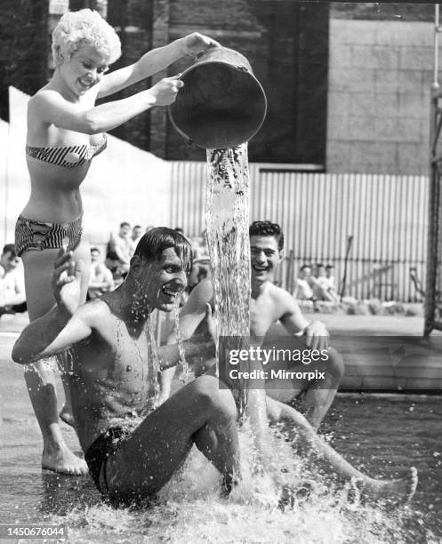 One way to cool off in the present heat wave is to have a bucket of cold water thrown over you, but when it is thrown by attractive blonde Vera Day...