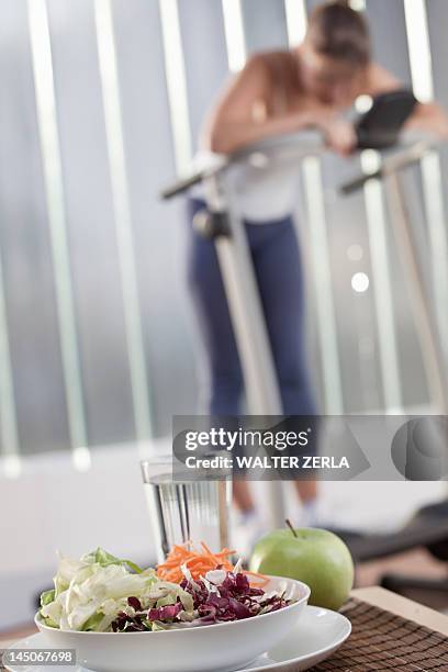 plate of salad in home gym - focus on foreground stock pictures, royalty-free photos & images