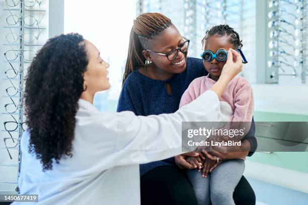 women, girl or mother with children optometrist for eye test, healthcare wellness exam or vision glasses fitting. smile, happy or mom with kid optometry or prescription lens in eye care medical store - eye exam stock pictures, royalty-free photos & images