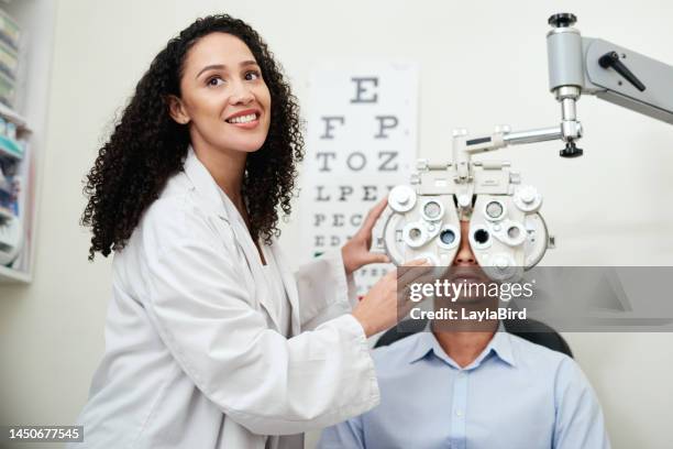 optometry, test eyes and optician with a man, consulting and communication about inspection with machine. medical, exam and optometrist with a patient for vision check or problem with results - profissional de oftalmologia imagens e fotografias de stock