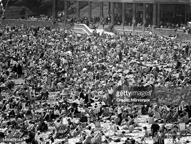 By the thousand they went on foot, by car, motorcycle, and train to Barry Island yesterday to stake a place in the sun. 17th May 1964.