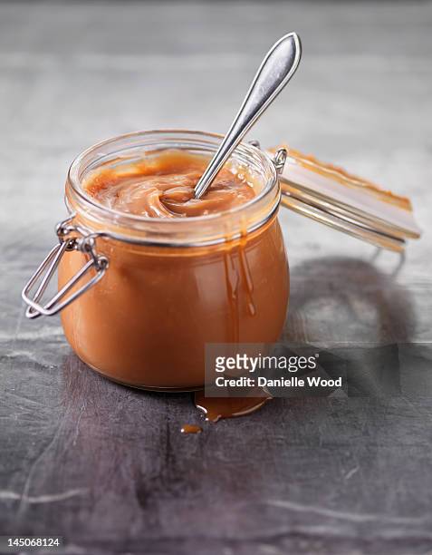 close up of pot of caramel sauce - caramel sauce stock pictures, royalty-free photos & images