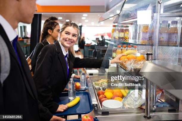 waiting in the lunch line - cafeteria stock pictures, royalty-free photos & images