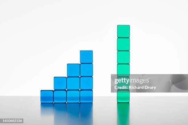 conceptual image of transparent coloured cubes - side by side comparison stock pictures, royalty-free photos & images