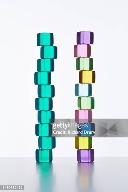conceptual image of transparent coloured cubes - equality act stock pictures, royalty-free photos & images