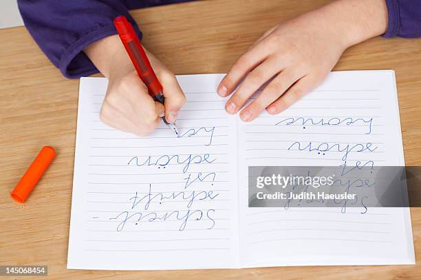 student practicing handwriting in class - handwriting school stock pictures, royalty-free photos & images